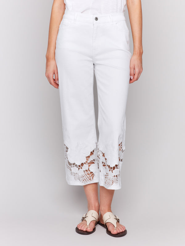 White flare jeans featuring stretch denim material by Charlie B.