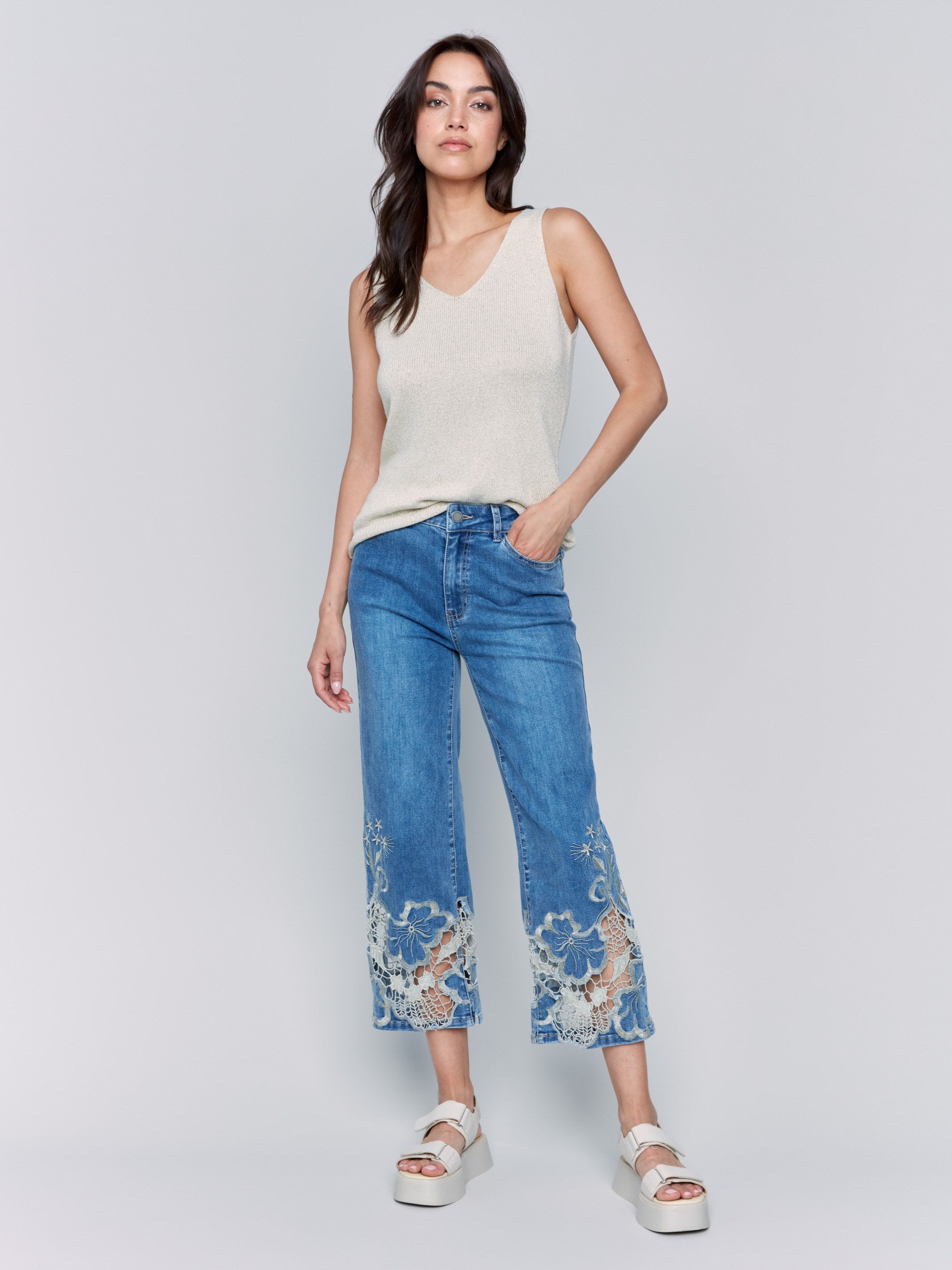 Medium blue jeans with stretch denim material, featuring a stylish design by Charlie B.