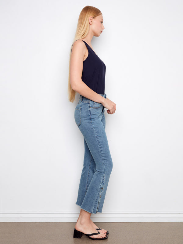 Stylish blue cropped bootcut jeans showcasing convenient side snaps at the hem for an adjustable fit by Charlie B.