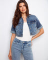 Medium blue denim jacket with a chic button closure and short, rolled sleeves for a trendy look by Charlie B.