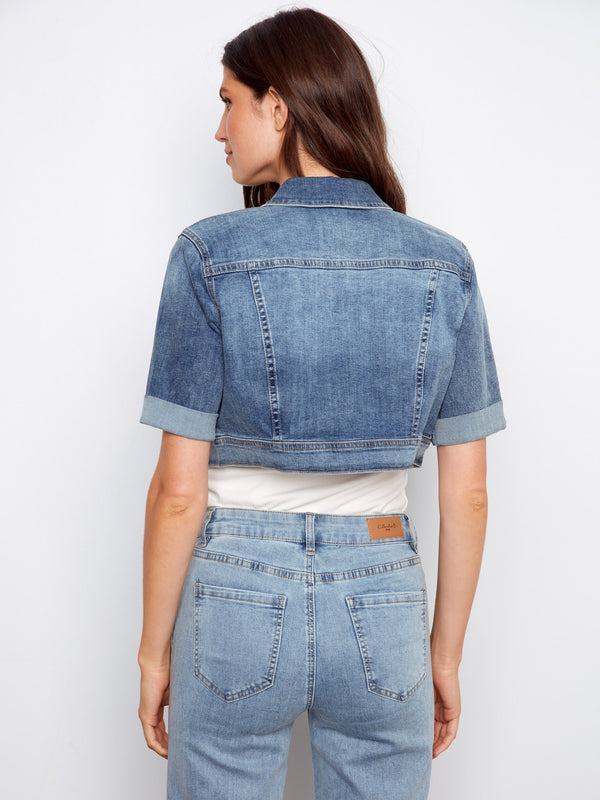 Fashion-forward cropped denim jacket in medium blue with essential button closure details for versatile styling by Charlie B.