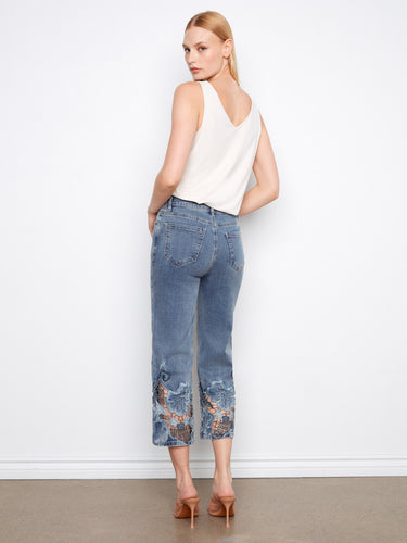 Regular rise denim jeans with beautiful lace hem detailing, providing an elegant yet casual look. By Charlie B.
