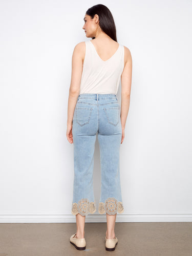 Cropped length light blue jeans showcasing exquisite lace hem detail for a fashionable touch by Charlie B.