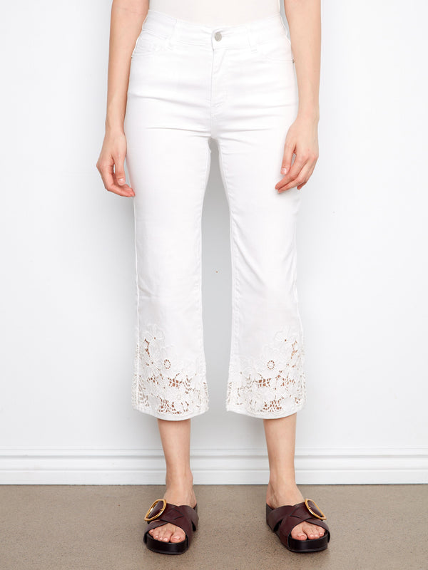 Adorned with a laser-cut lace hem, these pants add a touch of sophistication to your wardrobe essentials. By Charlie B.