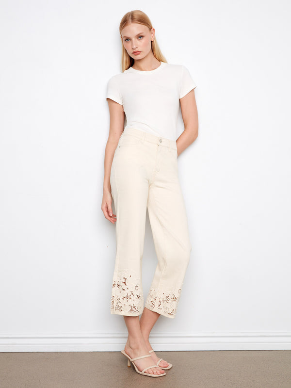 Natural jeans with a flared fit and floral lace hem, crafted in stretch twill for comfort and style by Charlie B.