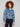 The intricate floral jacquard pattern elevates this blue cropped denim jacket for a chic look by Charlie B.