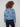 Experience the trendy appeal of this cropped length denim jacket with elegant floral design by Charlie B.