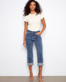 Blue cropped jeans with a straight fit and regular rise, enhanced by a scallop cuff for added style by Charlie B.