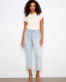These jeans feature a flared leg design, offering a stylish silhouette with their unique removable feather hem by Charlie B.