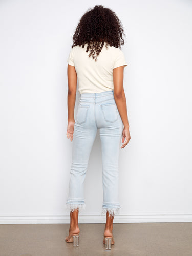 The frayed details add an edgy touch to these regular rise jeans, making them versatile for any occasion by Charlie B.