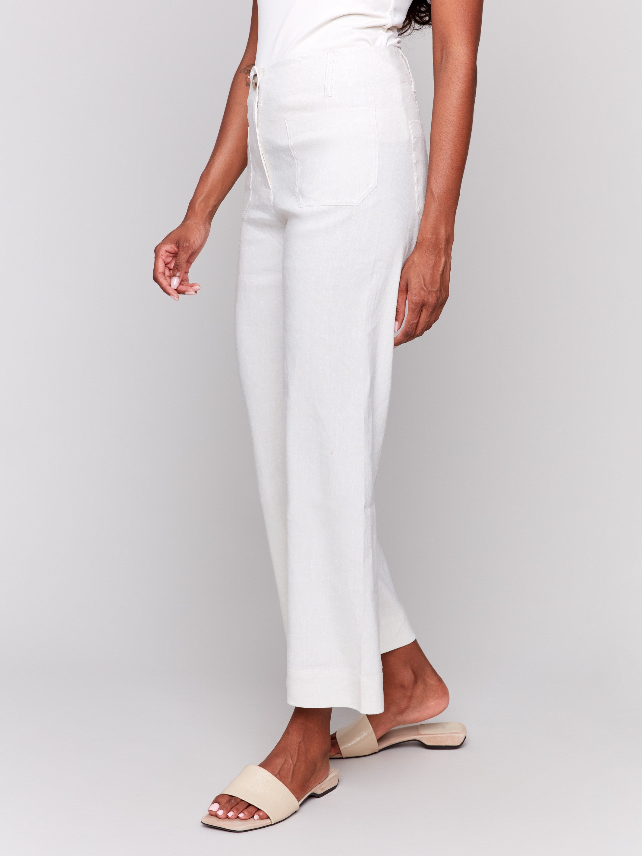 Cropped length trousers in a natural shade by Charlie B.