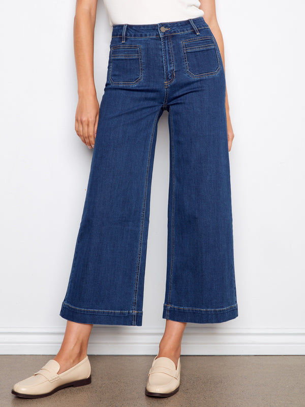 Featuring practical front patch pockets and back pockets, these jeans combine utility with fashion. By Charlie B.