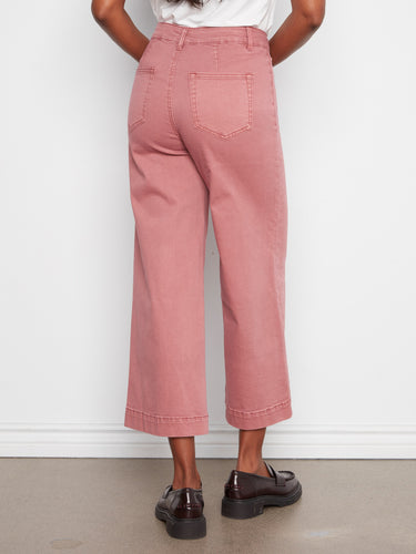 Featuring patch pockets, these pants combine utility with style effortlessly. A creation by Charlie B.