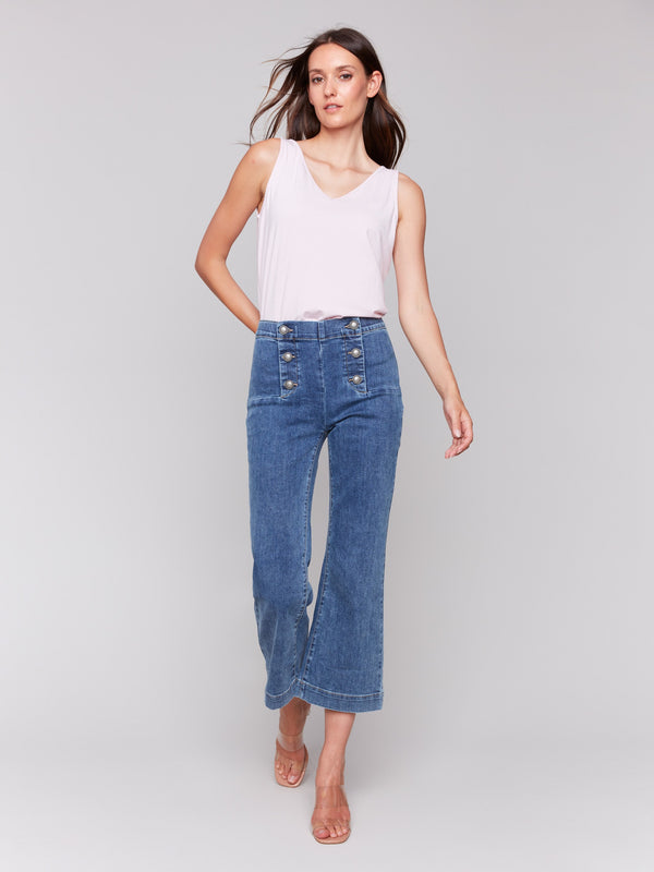 Cropped jeans with stretch denim and front button accents by Charlie B.