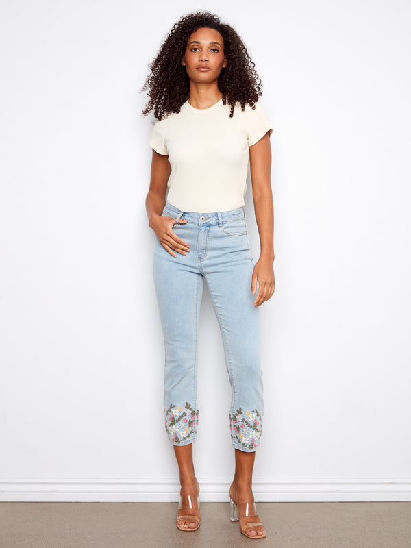 Denim jeans featuring a slim fit with floral embroidery at the hem, adding a touch of elegance to your casual look by Charlie B.