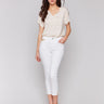 White cropped jeans with slim fit and side slit detail by Charlie B.