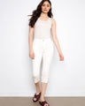 White cropped jeans featuring a slim fit and regular rise, perfect for versatile styling by Charlie B.