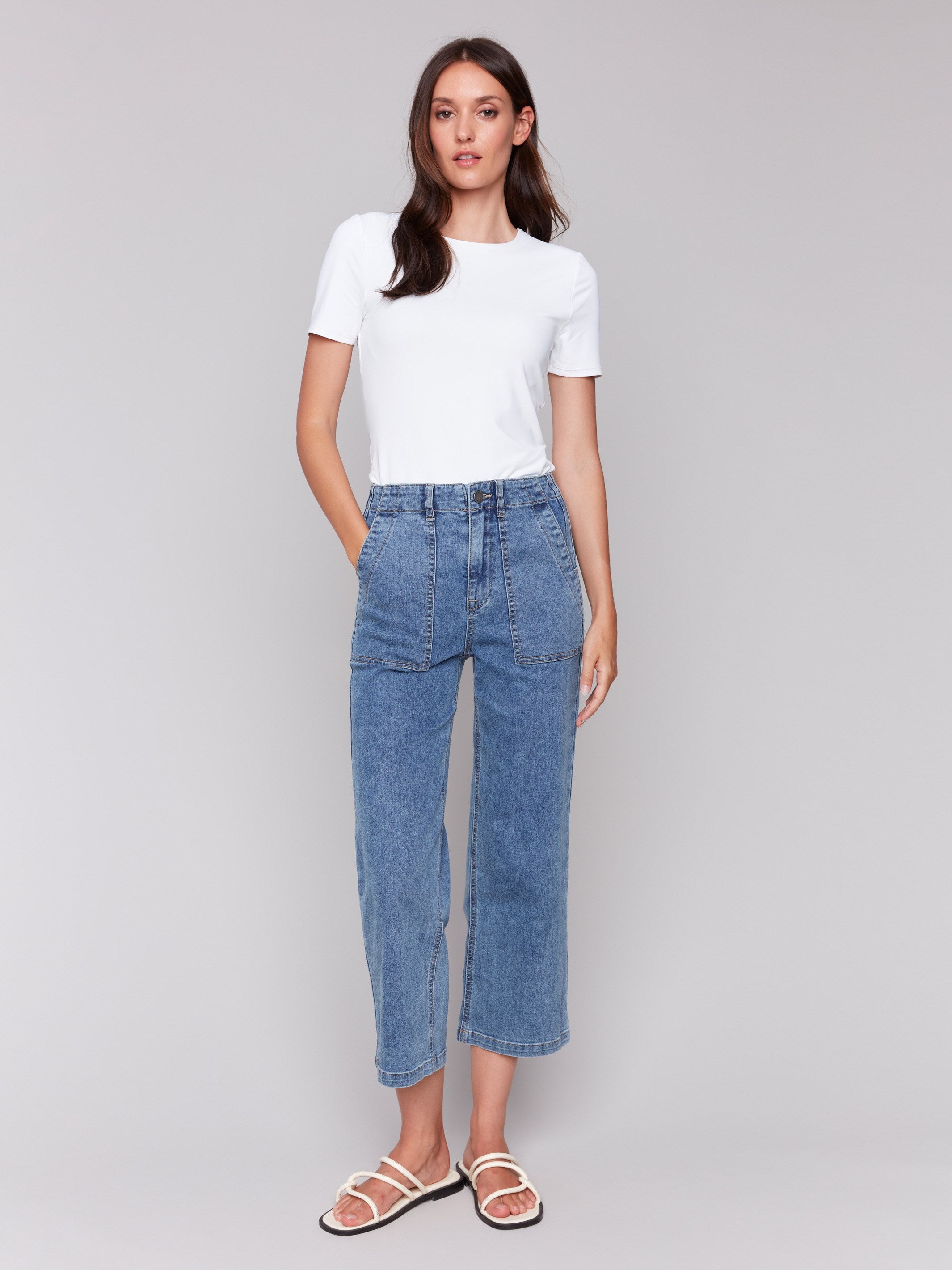 Medium blue jeans in straight fit with utility pockets by Charlie B.
