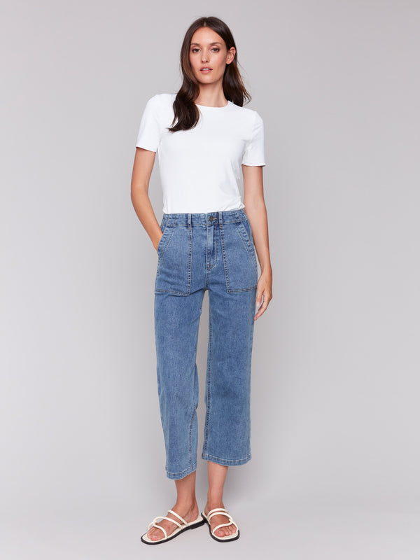 Medium blue jeans in straight fit with utility pockets by Charlie B.
