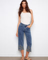Denim pants featuring a wide fit and cropped length, highlighted by intricate flower embroidery at the hem. By Charlie B.