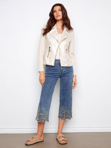 These versatile cropped jeans are perfect for any occasion, featuring eye-catching floral details on comfortable stretch denim. By Charlie B.
