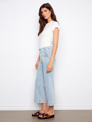 Highlighting side button details, these jeans bring a unique flair to classic denim style. By Charlie B.