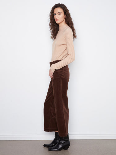 Crafted from stretch corduroy, these brown pants provide flexibility and ease of movement for everyday wear by Charlie B.