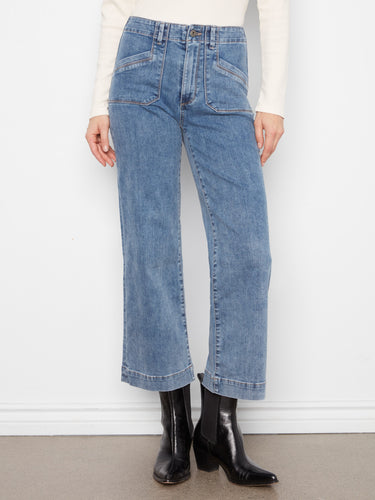 Cropped length denim in medium blue with stylish rectangular patch pockets, offering a modern fit by Charlie B.