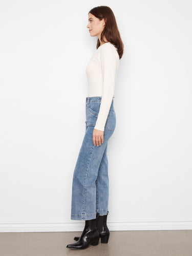 Stretch denim wide-leg pants in medium blue, crafted for comfort and style, highlighted by unique patch pockets by Charlie B.