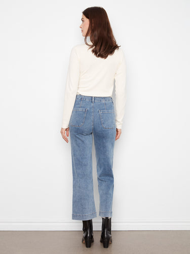 Regular rise cropped jeans in medium blue with distinct rectangular patch pockets for added flair by Charlie B.