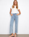 These jeans feature a flattering wide leg design, perfect for a chic, relaxed look. Made with stretch denim for comfort by Charlie B.