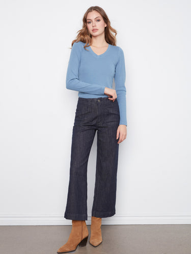 Regular rise stretch denim pants styled effortlessly with brown boots and a light blue top. Fashionably made by Charlie B.