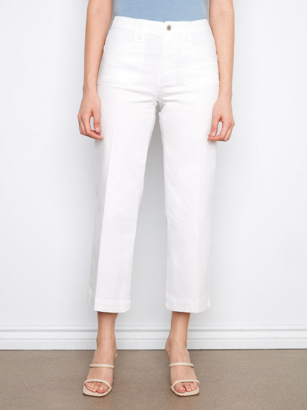 These white jeans with rectangular patch pockets offer a stylish and practical touch by Charlie B.