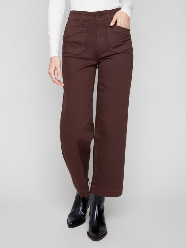 These mocha pants boast a cropped length and rectangular front patch pockets, perfect for everyday style by Charlie B.