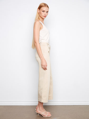 The regular rise of these beige wide-leg pants complements their fashionable side button detail by Charlie B.