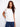White cotton top featuring a crew neckline for a classic look. Enhanced with embroidery at the shoulder by Charlie B.