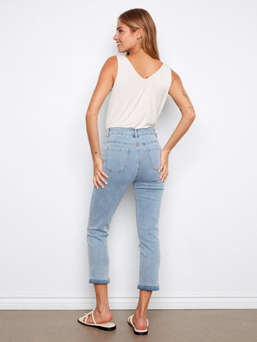 Versatile light blue jeans featuring a cuffed hem and cropped length for a chic look in any season by Charlie B.