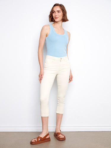 Regular rise design provides ease of wear, matched with a sky-blue tank top for simple elegance. By Charlie B.