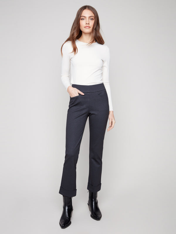 Navy ponte pants featuring straight leg design and cuffed hems, offering a sleek silhouette by Charlie B.