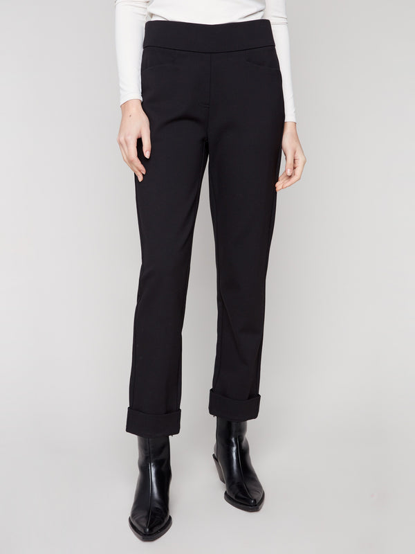 Ankle-length black pants crafted from stretch fabric for comfort and elegance by Charlie B.