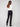 These chic black pants feature welt pockets on each side, blending style with functionality by Charlie B.
