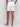 Chic white shorts with two front and two back pockets by Charlie B.
