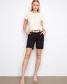 Black shorts featuring a stylish cuffed hem, paired with a woven belt for added flair. Perfect for casual outings by Charlie B.