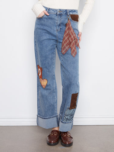 Crafted in stretch denim, these ankle-length jeans offer both comfort and style. Adorned with decorative elements by Charlie B.
