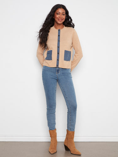 Stylish cardigan with denim patch pockets, adding a unique touch to the outfit. Crafted from soft cotton by Charlie B.