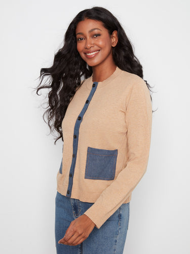 Button-up cardigan showcasing a denim button placket, perfect for layering in any season. Crafted from pure cotton by Charlie B.