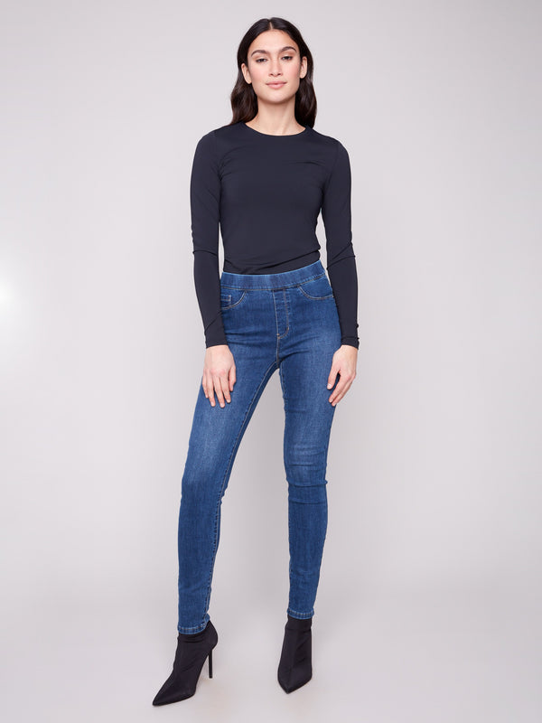 Indigo denim pants featuring a long length and skinny fit, perfect for versatile styling by Charlie B.