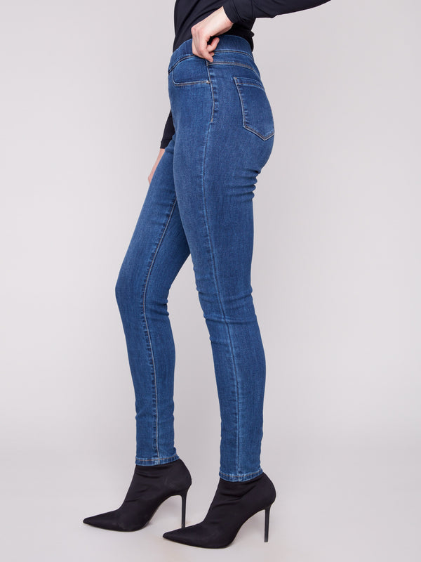 These indigo skinny jeans have two front mock pockets and back patch pockets for added style by Charlie B.