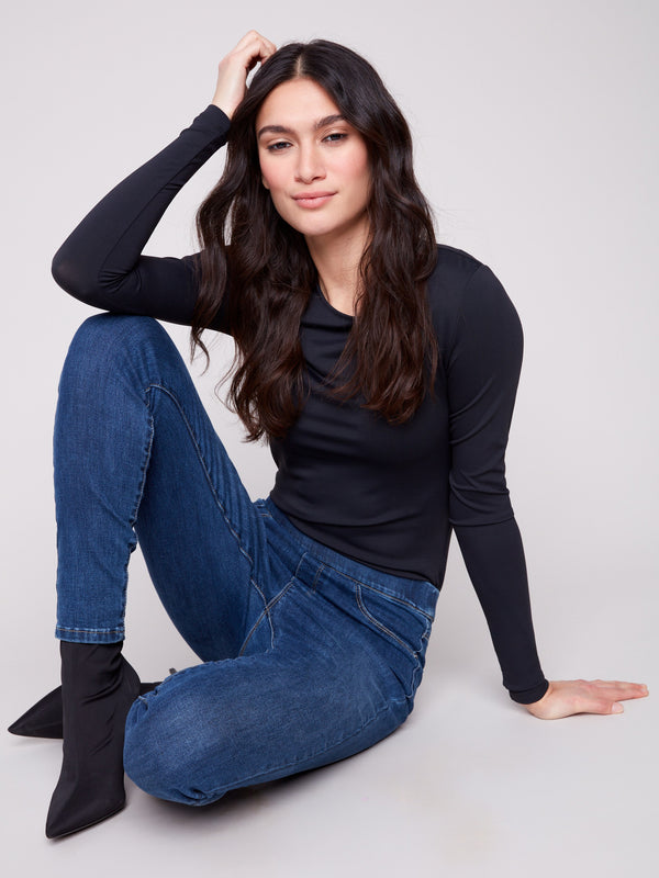 Designed with a regular rise, these denim pants offer a flattering silhouette in any setting by Charlie B.