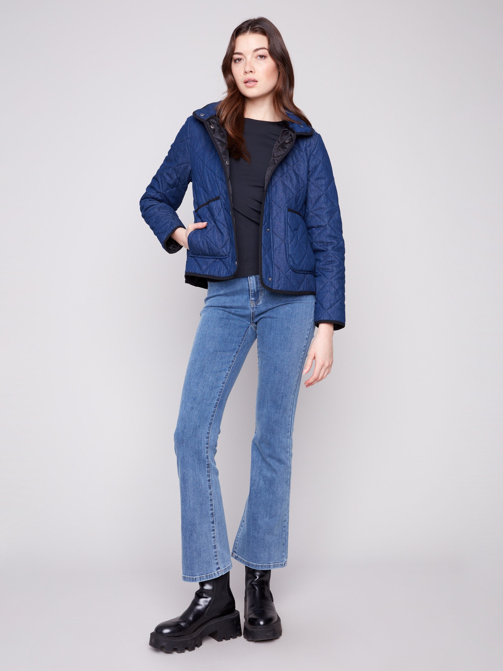 Blue denim quilted puffer jacket with 100% cotton exterior, featuring a sleek high collar by Charlie B.